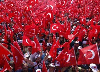 Turkish wave flags of their country as they take part in a Democracy and Martyrs' Rally in Istanbul, Sunday, Aug. 7, 2016. Hundreds of thousands of flag-waving supporters gathered in Istanbul Sunday for a giant rally to mark the end of nightly demonstrations since Turkey's July 15 abortive coup that left more than 270 people dead. (AP Photo/Emrah Gurel)